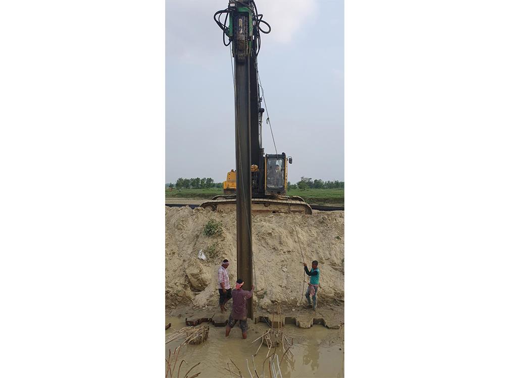 Providing and driving sheet pile wall along toes of Railway bank at Major Bridge No. 133 between GGH-NMA in connection with gauge conversion of Sakri-Nirmali section. 